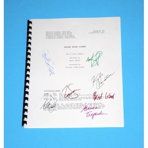 May include: A black and white script for the TV show "Friday Night Lights" with the episode title "What's Your Daddy?" and signatures from the cast and crew, including Kyle Chandler, Brad Leland, and Aimee Teegarden.