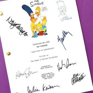 May include: A white paper with the title "The Simpsons" and character illustrations, along with multiple signatures. The script is titled "Last Exit to Springfield" and includes the names of the writers and creators.
