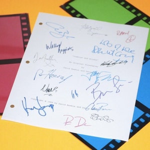 May include: A white sheet of paper with multiple blue, black, and red signatures. The paper has a film strip border and the text "Copyright 1999 by David Keskin and Gary Tarn" is visible.