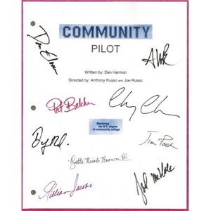 May include: A white script with the title "COMMUNITY" and "PILOT" written in blue. The script is signed by the cast and crew, including Dan Harmon, Anthony Russo, Joe Russo,  Pat Belcher, Chevy Chase, Donald Glover, Yvette Nicole Brown, Gillian Jacobs, and Joel McHale.