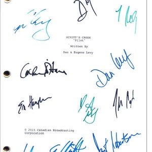 May include: A white sheet of paper with blue ink signatures from the cast and writers of the TV show "Schitt's Creek". The signatures include Dan Levy, Eugene Levy, Catherine O'Hara, Emily Hampshire, Sarah Levy, Annie Murphy, and  the show's creator Dan Levy. The paper also includes the show's title, "Schitt's Creek", the episode title, "Pilot", and the copyright information, "© 2015 Canadian Broadcasting Corporation".