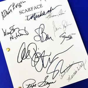 May include: A white script page for the movie "Scarface" with multiple signatures in black ink. The signatures include: Brian De Palma, Oliver Stone, Michelle Pfeiffer, Steven Bauer, Robert Loggia, Al Pacino, Pepe Serna, and others.