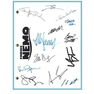 May include: A white sheet of paper with the title "FINDING NEMO" in blue and black lettering. The paper is signed by the cast and crew of the movie, including Ellen DeGeneres, Albert Brooks, and Willem Dafoe.