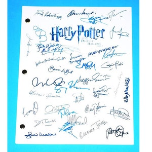 May include: A white sheet of paper with blue ink signatures from the cast and crew of the movie "Harry Potter and the Deathly Hallows: Part 2".