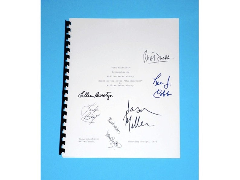 May include: A white page with a black binding, featuring the title "The Exorcist" and signatures from the cast and crew, including Ellen Burstyn, Jason Miller, and Lee J. Cobb.
