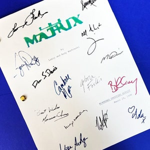 May include: A white page with the title "MATRIX" in green and blue lettering. The page is signed by various people, including the Wachowskis, Don S. Davis, Carrie-Anne Moss, Gloria Foster, and others. The page also includes the text "NUMBERED SHOOTING SCRIPT" and the date "March 29, 1998".