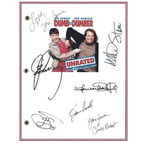 May include: A white script with the title "Dumb and Dumber" and the words "Unrated" in a red box. The script is signed by Jim Carrey, Jeff Daniels, and other cast members.