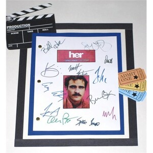 May include: A white framed script for the movie "her" with signatures from the cast and crew, including Joaquin Phoenix, Spike Jonze, and Bill Hader. The script is accompanied by three movie ticket stubs.