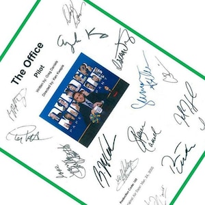 May include: A white sheet of paper with the title "The Office" and the word "Pilot" written on it. The paper is signed by the cast of the show, including Steve Carell, John Krasinski, Jenna Fischer, and others. The paper also includes the production code and original air date.