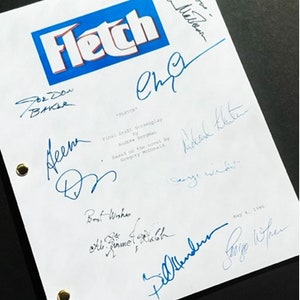 May include: A white script with the title "Fletch" in blue and red letters. The script is signed by several people, including Chevy Chase,  "For Dow Baker", "Al", "Best Wishes", "Bill Murray", "Cage Widi", "Abdal Khater", and "Greg Widner".