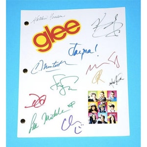 May include: A white sheet of paper with the word "Glee" in red and yellow letters. The paper is signed by multiple people, including Matthew Morrison, Chris Colfer, Lea Michele, and Cory Monteith. There is a photo of the Glee cast in the bottom right corner.