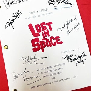May include: A white script with the title "Lost in Space" in red letters. The script is signed by the cast and crew, including Guy Williams, June Lockhart, Mark Goddard, Bill Mumy, and Jonathan Harris. The script is dated December 13, 1965.