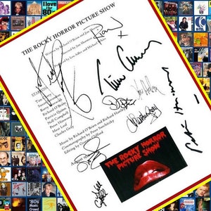 May include: A white sheet of paper with black text listing the cast and crew of the movie "The Rocky Horror Picture Show". The paper is signed by the cast and crew, including Tim Curry, Susan Sarandon, and Richard O'Brien. The signatures are in black ink.