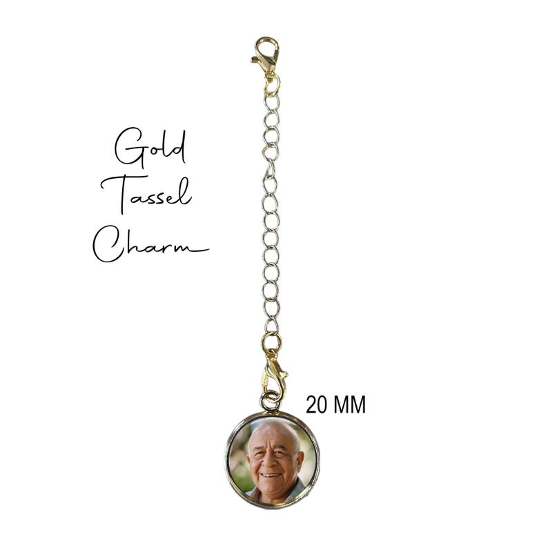 May include: Gold tassel charm with a 20 mm round photo locket featuring a man's smiling face.