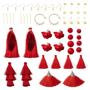 May include: A set of red tassel earring making supplies. The set includes red feather tassels, red fabric tassels, red flower charms, red beads, earring hoops, earring wires, jump rings, and gold head pins.