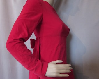 May include: A long-sleeved, red dress with a bow at the waist.