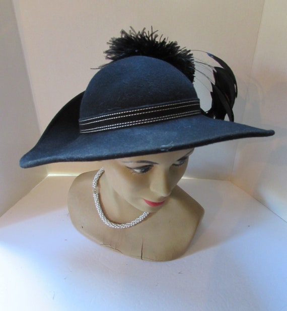 black-felt-hat-wide-brim-upturned-brim-ostrich-feathe-gem