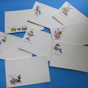 May include: A collection of white rectangular greeting cards featuring various colorful illustrations and handwritten text including Happy Birthday, Congratulations, Get Well Soon, Wishing You Well, Thinking of You, and Thank You in different scripts.