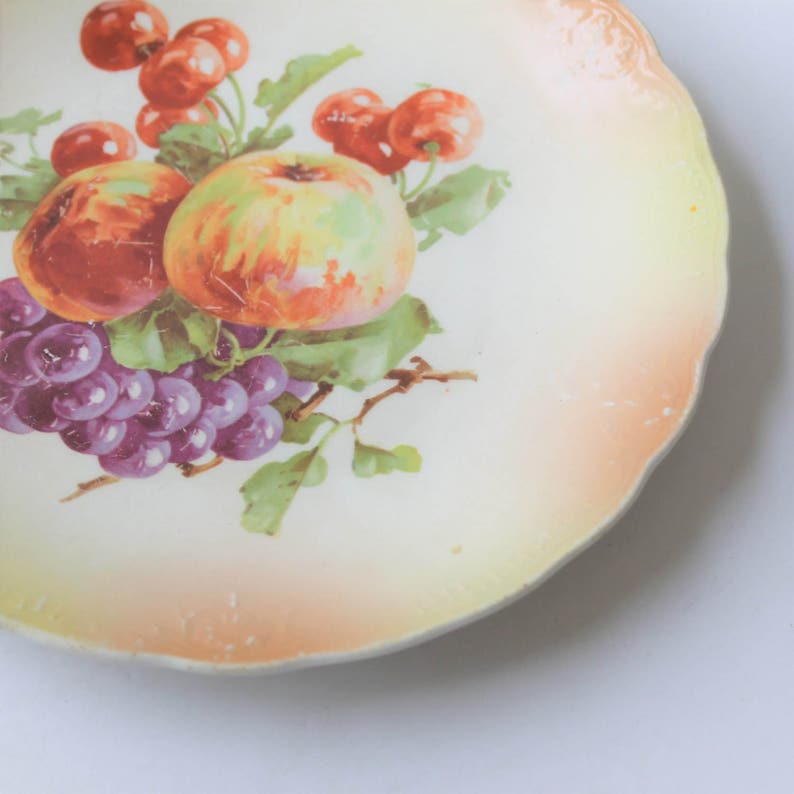 China 076 apples W.E.B cottage d\u00e9cor Vintage cottage chic china plates and grapes on pink and yellow background Co cherries