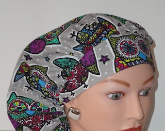 May include: A gray scrub hat with a colorful owl and star pattern.