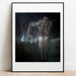 May include: A framed art print featuring a dark, moody painting of a seated figure with pale, glowing eyes. The figure rests their chin on a hand, surrounded by deep shadows and subtle blue light accents, set within a simple black frame.