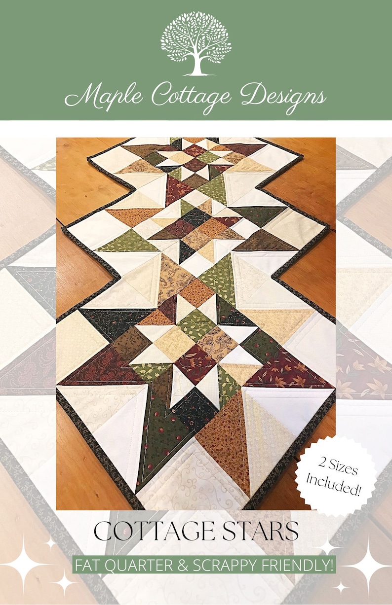 May include: A quilted table runner with a geometric pattern of stars in shades of brown, green, white, and cream. The runner is edged with a dark brown trim. The text "COTTAGE STARS" and "FAT QUARTER & SCRAPPY FRIENDLY!" is printed below the runner. The text "2 Sizes Included!" is printed on a white circle with a brown border.
