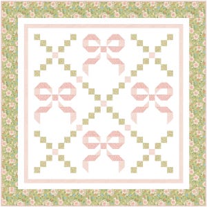 May include: A quilted blanket with a white background featuring pink bows and green and gold square accents. The border is a floral pattern in shades of green, pink, and white. The quilt has a classic, feminine design.