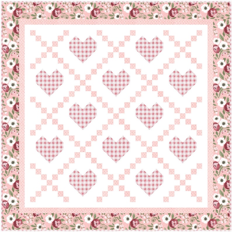 May include: A pink and white quilt with a checkered heart pattern. The quilt has a floral border with pink and white flowers.