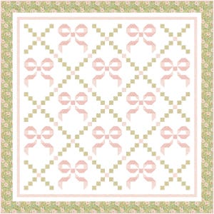 May include: A square quilt with a repeating pattern of pink bows on a white background. The bows are arranged in a diamond grid, with small green squares between them. The quilt has a floral border in shades of green and pink.