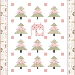 May include: A quilt featuring a white background with a repeating pattern of eight pine trees and one central house shape with a heart cutout. The trees and house are made of pink and green floral fabric. A border displays small figures and text.