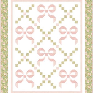 May include: A handmade quilt with a repeating pattern of pink bows on a white background. The bows have a polka dot design. The quilt is bordered with a floral pattern in shades of green and pink, and a pink border.