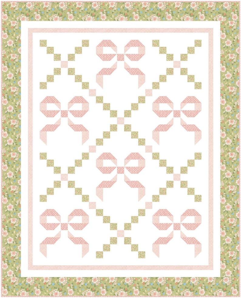 May include: A handmade quilt with a repeating pattern of pink bows on a white background. The bows have a polka dot design. The quilt is bordered with a floral pattern in shades of green and pink, and a pink border.