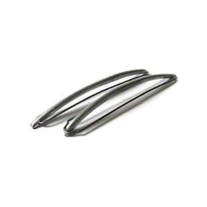 May include: Two silver-colored, curved metal objects, possibly handles or decorative elements, are positioned diagonally against a white background. The objects have a smooth, reflective surface and a simple, minimalist design.