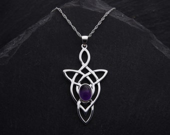 May include: A silver Celtic knot pendant necklace with a purple amethyst gemstone in the center.