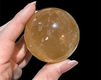 Golden calcite sphere, large crystal sphere