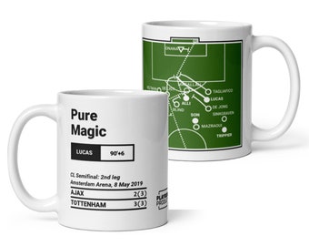 May include: White ceramic mug with a green soccer field graphic and a white text overlay that reads "Pure Magic" and "Lucas 90'+6". The text below the graphic reads "CL Semifinal: 2nd leg Amsterdam Arena, 8 May 2019 AJAX 2(3) TOTTENHAM 3(3)"
