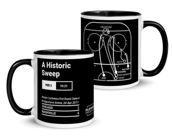 May include: A white coffee mug with a black rim and handle. The mug features a black and white hockey game illustration with the text "A Historic Sweep" and game details. The text "PER 3 10:21" is also included. The text "Western Conference First Round: Game 4 Bridgestone Arena, 20 Apr 2017" is included. The text "CHICAGO 1 NASHVILLE 4" is also included.