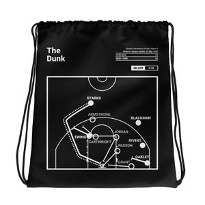 May include: Black and white drawstring bag with a basketball court diagram and the text "The Dunk" and "Eastern Conference Finals Game 2 Madison Square Garden, 23 May 1993". The diagram shows the players' positions on the court during a game.
