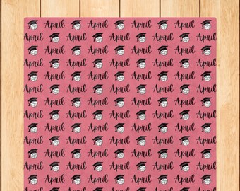 May include: A pink background with a repeating pattern of the word "April" and a black and white volleyball with a graduation cap on top.