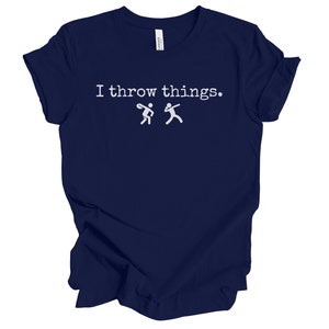 May include: A navy blue t-shirt with the text "I throw things." and two stick figures throwing a ball.