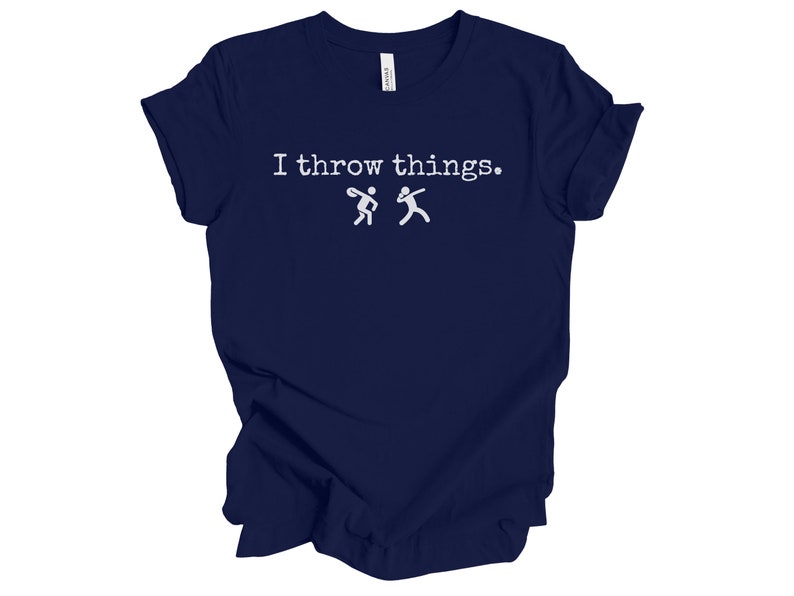 May include: A navy blue t-shirt with the text "I throw things." and two stick figures throwing a ball.