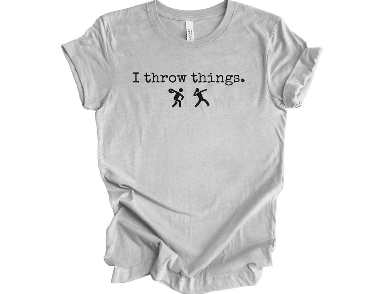 May include: A light gray t-shirt with the text "I throw things." and two stick figures throwing objects.