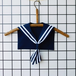 May include: A rustic wooden sign with the text "Welcome to our porch" in white lettering. The sign features a distressed finish and a simple, inviting design, perfect for outdoor decor.