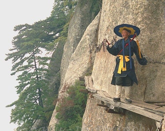 Chinese Monk walking along on mountain pathway, Portrait Film Photography, inspiration image.