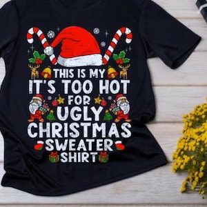 May include: Black t-shirt with a festive Christmas design. The graphic includes a Santa hat, candy canes, and the text "THIS IS MY IT'S TOO HOT FOR UGLY CHRISTMAS SWEATER SHIRT". A fun, holiday-themed tee.