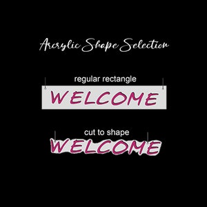 May include: An acrylic shape selection display featuring the text Acrylic Shape Selection at the top. Below are two examples of the word WELCOME in pink letters on a light background, labelled regular rectangle and cut to shape respectively.