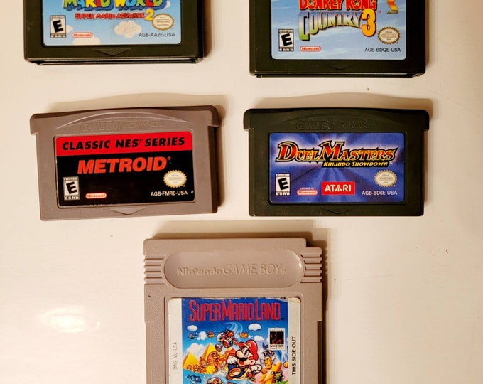 Nintendo Gameboy Advance Games: Super Mario Advance 2, Metroid, Donkey Kong Country 3, and Dual Masters. Each Sold Separately.