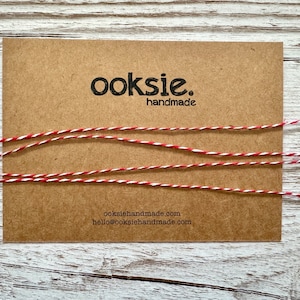 Red and white cotton bakers twine - approx 1mm thick. Price per continuous metre