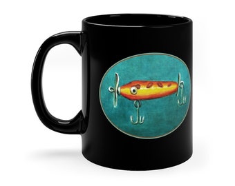 11oz Black Mug.  Orange Spinner Lure.