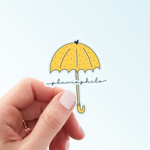 Pluviophile Sticker | Cute Yellow Umbrella Rainy Day Weatherproof Vinyl Sticker by Hello Happy Designs